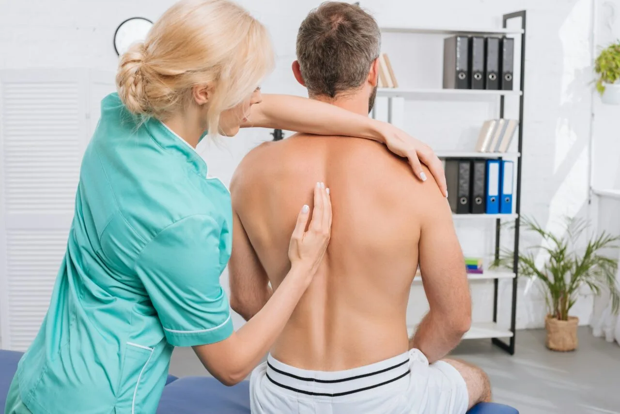 Female osteopathic specialist assessing a patient at Lavita Osteo clinic in Calgary